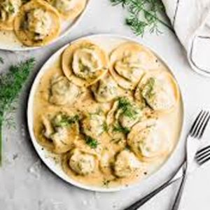 Ravioles Jam{on y Mozzarella c/bechamel o mixta